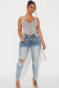 High-Rise Distressed Skinny Jeans in Light Wash