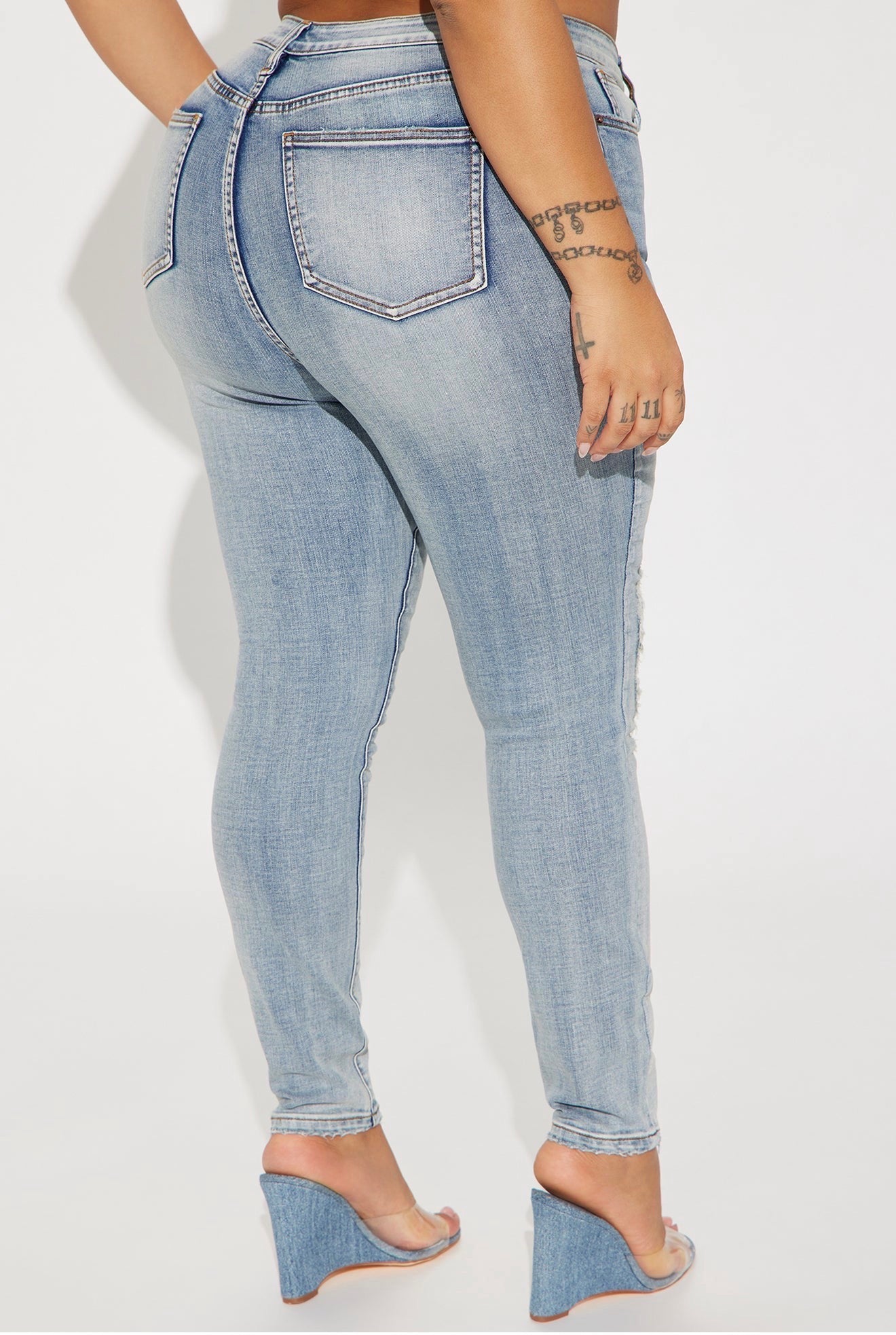 High-Rise Distressed Skinny Jeans in Light Wash